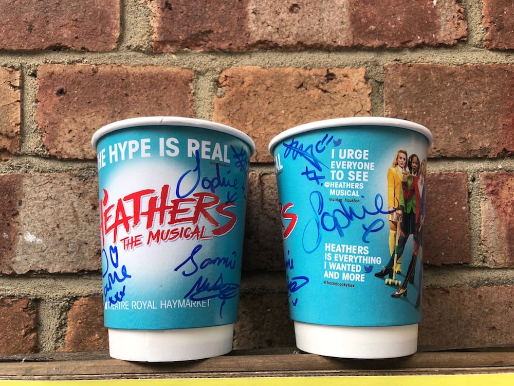 Featured image for “Enter our competition for a chance to win a Heathers Cup signed by Carrie Hope Fletcher, Jamie Muscato and the three Heathers”