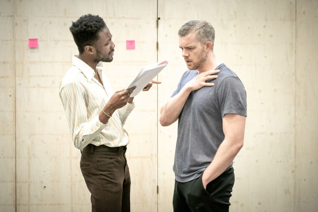 Omari Douglas and Russell Tovey. Photo by Marc Brenner